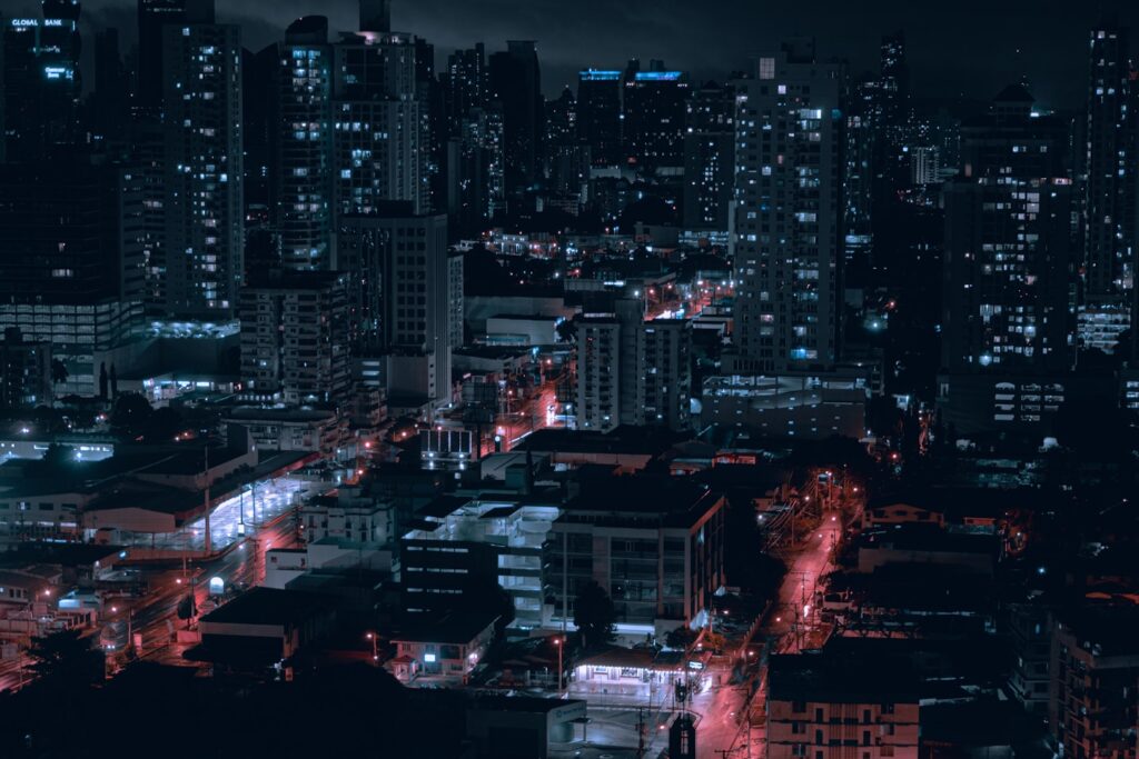 city with high rise buildings during night time